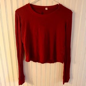 Slightly cropped red sweater
